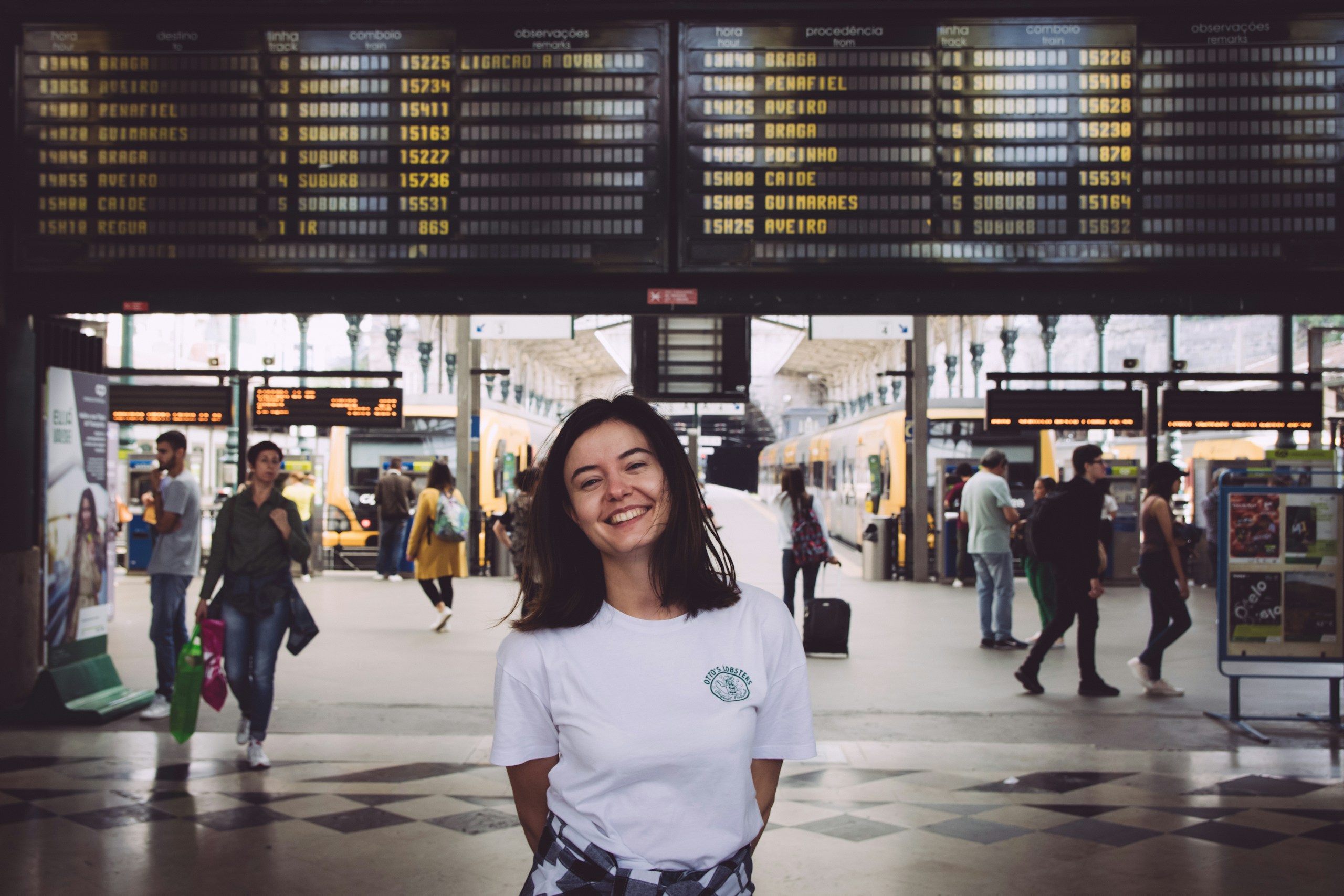 a female in white standing at the airport for travel in 2018 with the flexibility to go anywhere