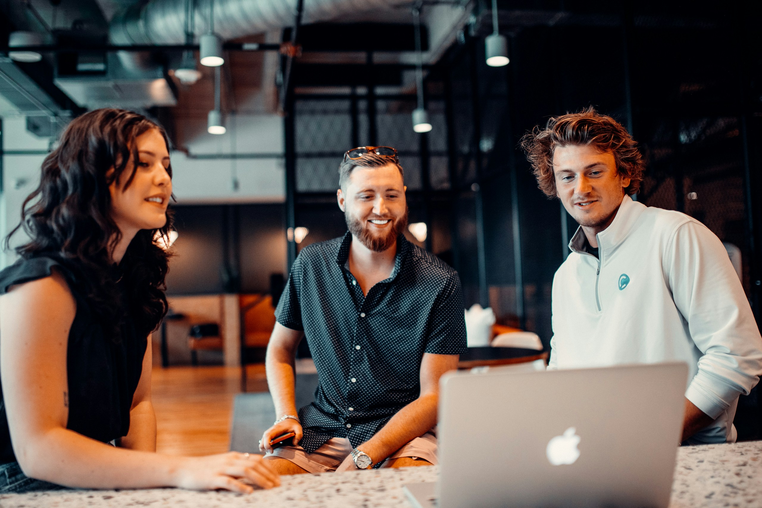 Three people working together